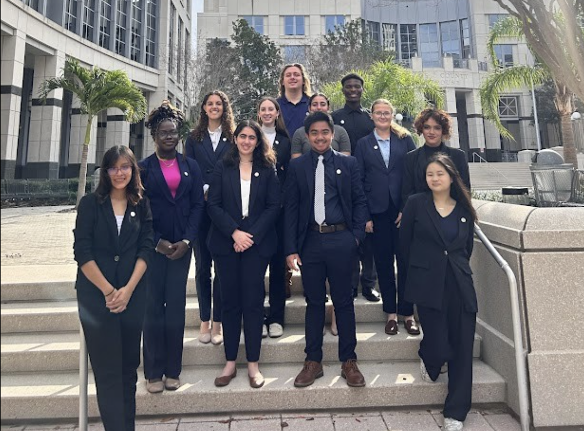  team standing in front of courthouse